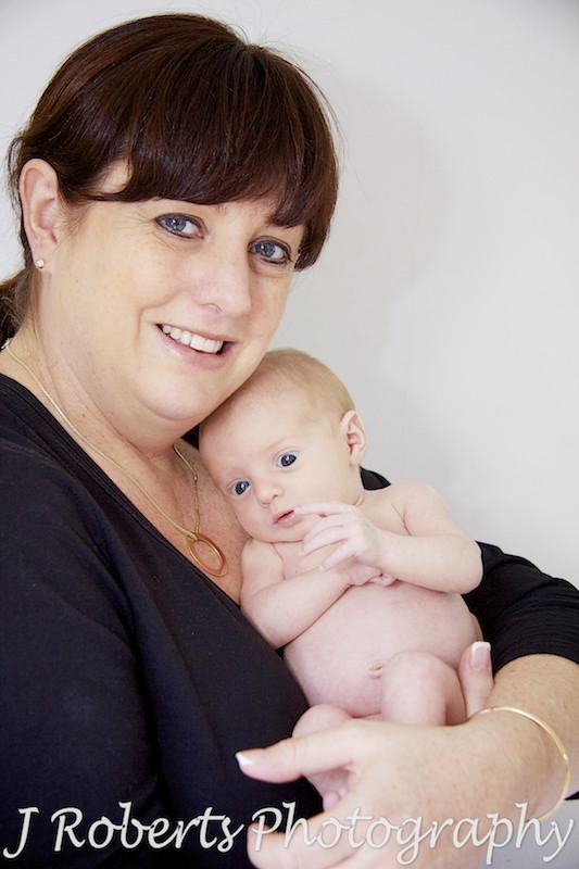 Mother and baby cuddling - newborn baby portraits sydney